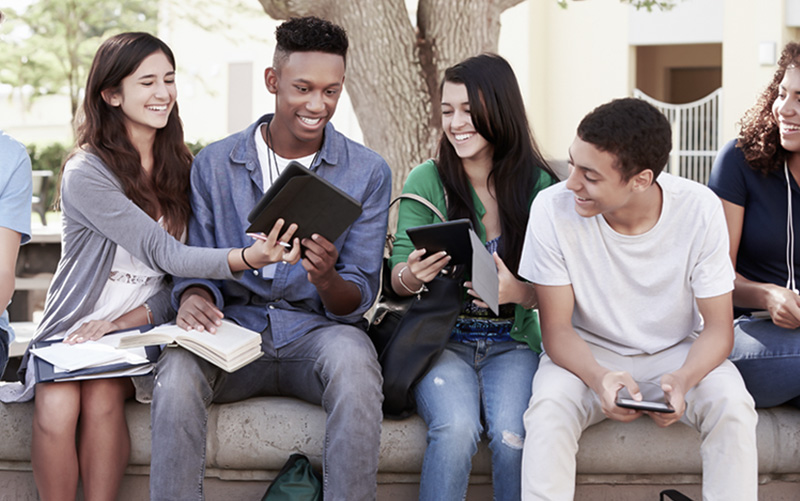 students sitting on bench homepage image